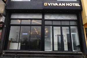 a window of a hotel on a city street at Hotel Vivaan - Walk to Banke Bihari Temple in Vrindāvan