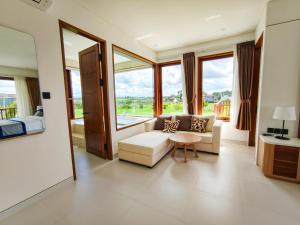 a living room with a couch and a table at Mountain Sunshine Private Villa in Darmasaba +44 photos