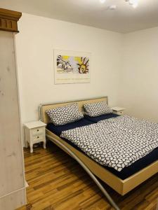 a bed with two pillows in a bedroom at FeWo Landblick in Hemau
