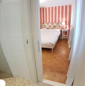 Posteľ alebo postele v izbe v ubytovaní Casa delle Ortensie