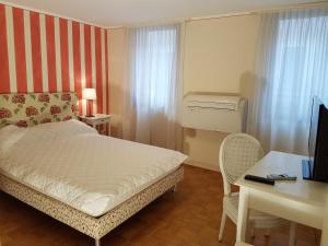 Posteľ alebo postele v izbe v ubytovaní Casa delle Ortensie