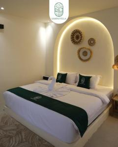 a bedroom with a large bed in a room at Sampai Villa Kama in Ngaglik