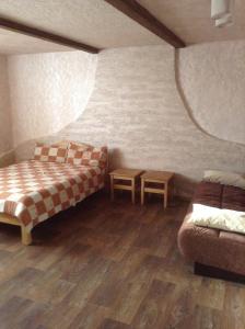 Ένα ή περισσότερα κρεβάτια σε δωμάτιο στο Usadba v Paperne