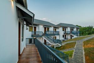 a balcony of a building with blue railing at Abad Silver Mist in Vagamon