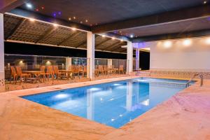a swimming pool on the roof of a building at Abad Silver Mist in Vagamon