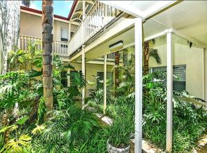 a building with a lot of plants in front of it at Number 4 Smugglers Inn in Victor Harbor