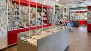 a store filled with lots of items on display at Hôtel Le Méditerranée in Lourdes