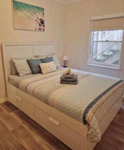 a large bed in a bedroom with a window at Number 4 Smugglers Inn in Victor Harbor +32 photos