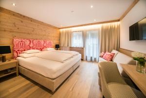 Giường trong phòng chung tại Hotel Garni Glockenstuhl