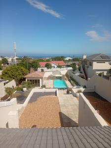 a view of a pool from the roof of a house at Ocean Glimpse in Cape Town