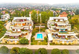 an aerial view of a house with a swimming pool at Koczor Apartman in Balatonfüred