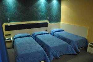 Postel nebo postele na pokoji v ubytování Aerhotel Phelipe