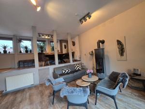 a living room with a couch and a table at Palais Picard Ostflügel in Thale