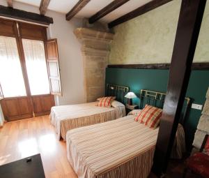 Postel nebo postele na pokoji v ubytování Vivienda Turística Yamaries + 27 fotografií