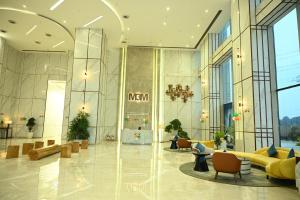 a lobby of a large building with at Let's Loft - A Premium Luxury Style Duplex Living in Gurgaon