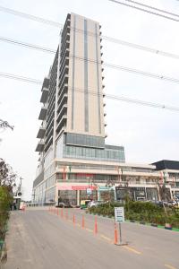 a tall building with a street in front of it at Let's Loft - A Premium Luxury Style Duplex Living in Gurgaon