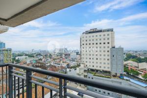 a view of a city from a balcony at Tanea by Kozystay - Braga in Bandung