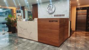 a reception desk in a lobby of a hotel at SVJ Hotel in Cebu City