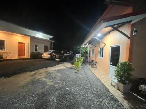 a car parked outside of a house at night at ไสวรีสอร์ท Sawai Resort in Ban Khao Noi