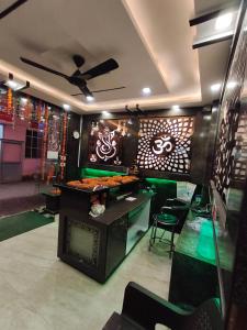 a restaurant with a counter with food on it at Hotel Jalsa in Haridwār