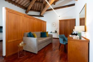 a living room with a couch and a table at Hotel Alle Acque in Lonigo