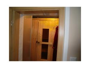 a mirror in a room with a door and a closet at Ferienhaus Krabiell in Saalfeld