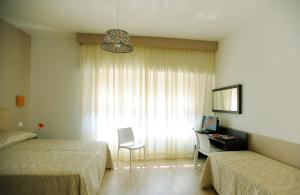 Posteľ alebo postele v izbe v ubytovaní Honey Rooms