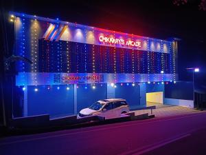 a car on display in front of a building with lights at Chikkary's Inn in Munnar
