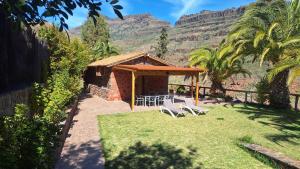 a gazebo with a group of chairs and a table at Casa Romantica in Los Palmitos