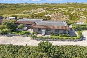 an aerial view of a house in the hills at Beach Bungalow Sylt 1 in Dikjendeel