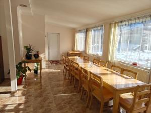 a large room with a long table and chairs at Tuz House R1 in Bakuriani