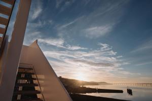 a view of the sunset from the balcony of a building at The Newport Inn in Newport-On-Tay