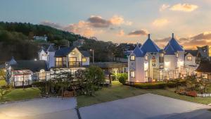 an aerial view of a large white house at Daebudo Sketch Pension in Ansan +8 photos