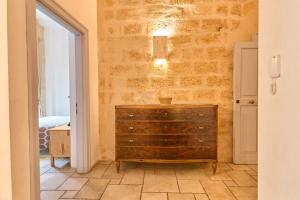a bedroom with a dresser in a room at Bed & Breakfast Casa Lopez in Barletta +90 photos