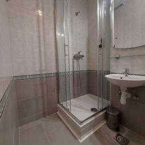 a bathroom with a shower and a sink at Hotel Prebold in Prebold +54 photos