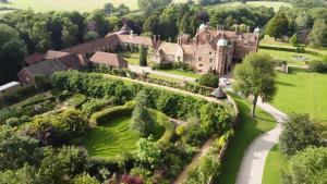 an aerial view of a mansion with a garden at Madingley Hall in Cambridge