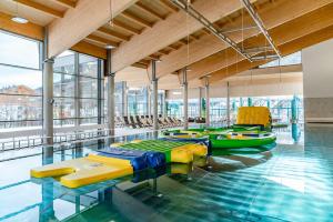 a pool with several rafts and kayaks in it at Ramsaublick in Ramsau am Dachstein