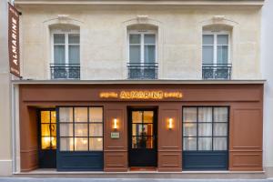 a building with the entrance to the awakening building at Almarine Eiffel Hotel & Spa by Malone in Paris