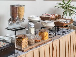 a buffet filled with different types of food at B&B HOTEL Calenzano First in Calenzano