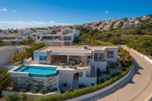 an aerial view of a house with a swimming pool at Lirios 182 Cumbre del Sol in Benitachell