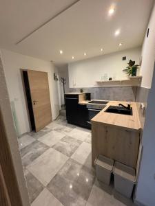 a large kitchen with a sink and a counter at Entspannt wohlfühlen! in Gießen +7 photos