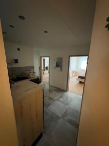 a kitchen with a counter top and a room at Entspannt wohlfühlen! in Gießen