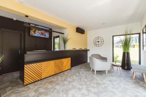 a living room with a bar with a tv above it at Glamping Terme Tuhelj in Tuheljske Toplice