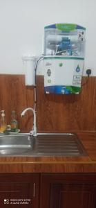 a kitchen counter with a mixer and a sink at Summerfield in Kandy