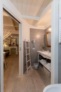 a bathroom with a sink and a ladder at SASSO BIANCO in Matera +30 photos