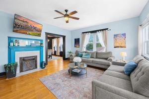 a living room with a couch and a fireplace at Walkable Historic District Riverview Escape in Jeffersonville