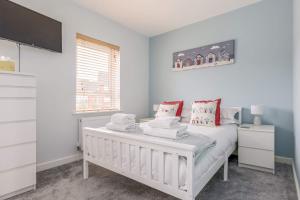 a bedroom with a white bed and a window at Avalon - Walking Distance to Poole Quay and Town in Poole