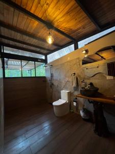 a bathroom with a toilet and a sink at Cabaña Montecielo San Rafael in San Rafael +18 photos