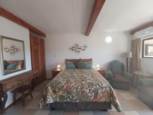 a bedroom with a bed and a desk and a chair at Crayfish Inn no.8 in Ramsgate