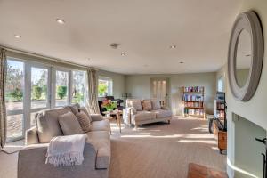 a living room with a couch and two chairs at Finest Retreats - The Old Windmill in Hindolveston